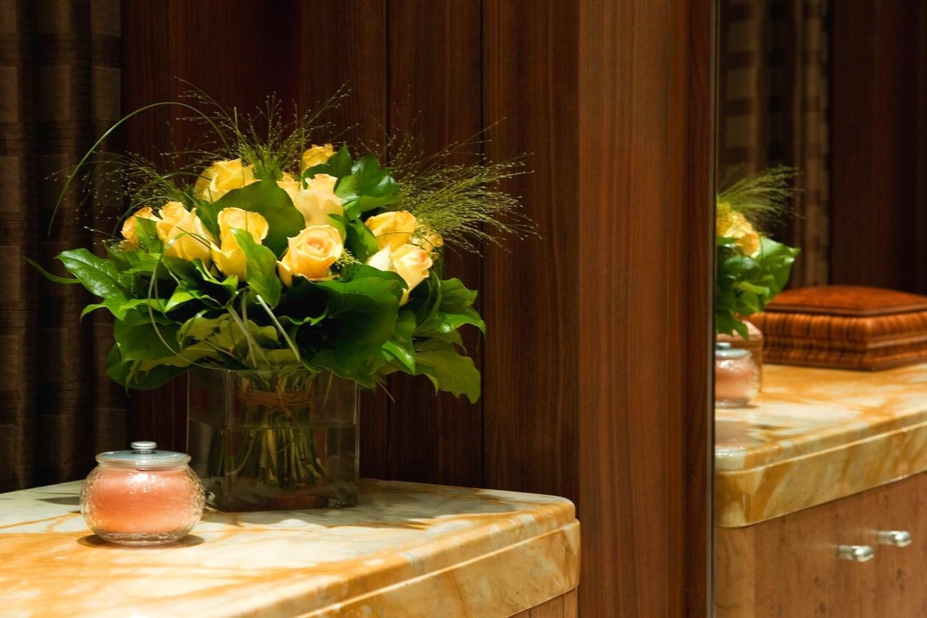 a vase with yellow flowers aboard QUEEN AIDA Yacht for Sale