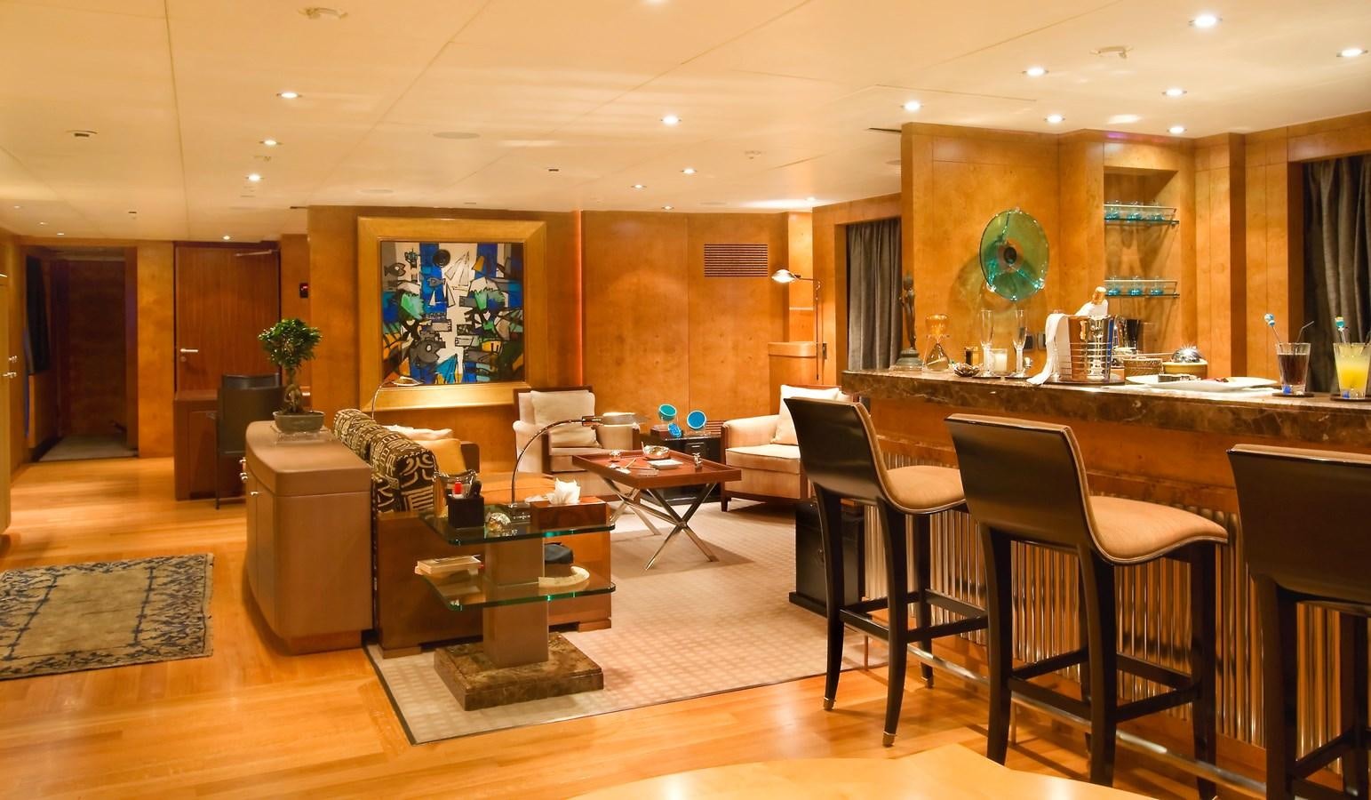 a room with a table chairs and a couch aboard QUEEN AIDA Yacht for Sale