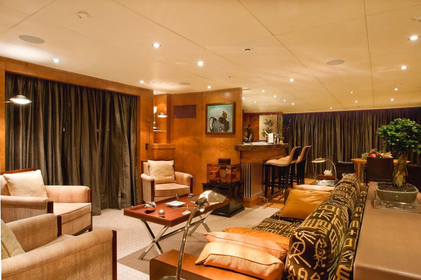 a living room with a couch and a table aboard QUEEN AIDA Yacht for Sale