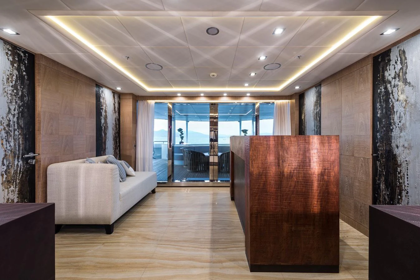 a room with a couch and a table aboard I NOVA Yacht for Sale