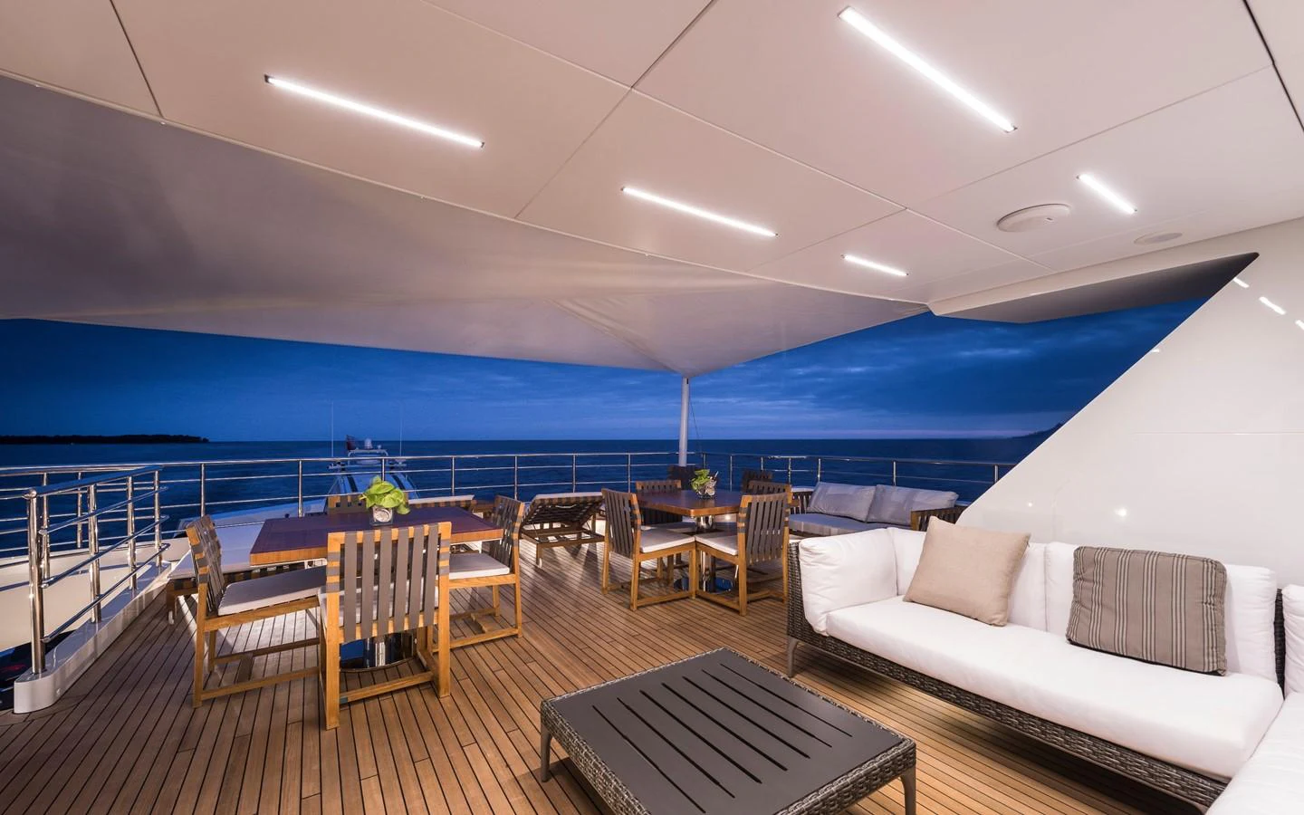 a room with a couch and a table and chairs aboard I NOVA Yacht for Sale