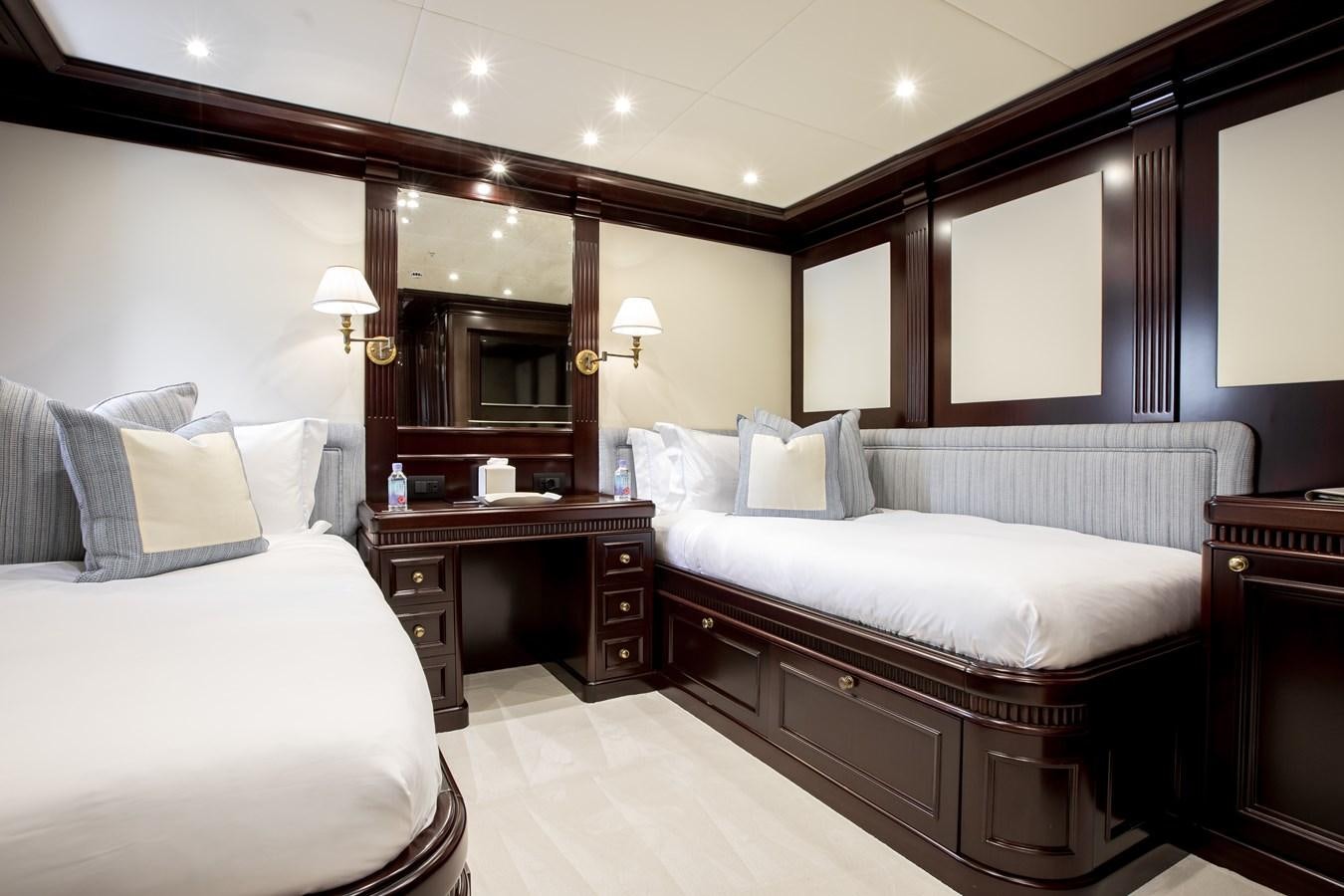 a room with a couple of beds aboard ELENI Yacht for Sale