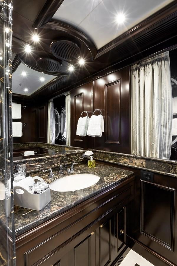 a bathroom with a large mirror aboard ELENI Yacht for Sale