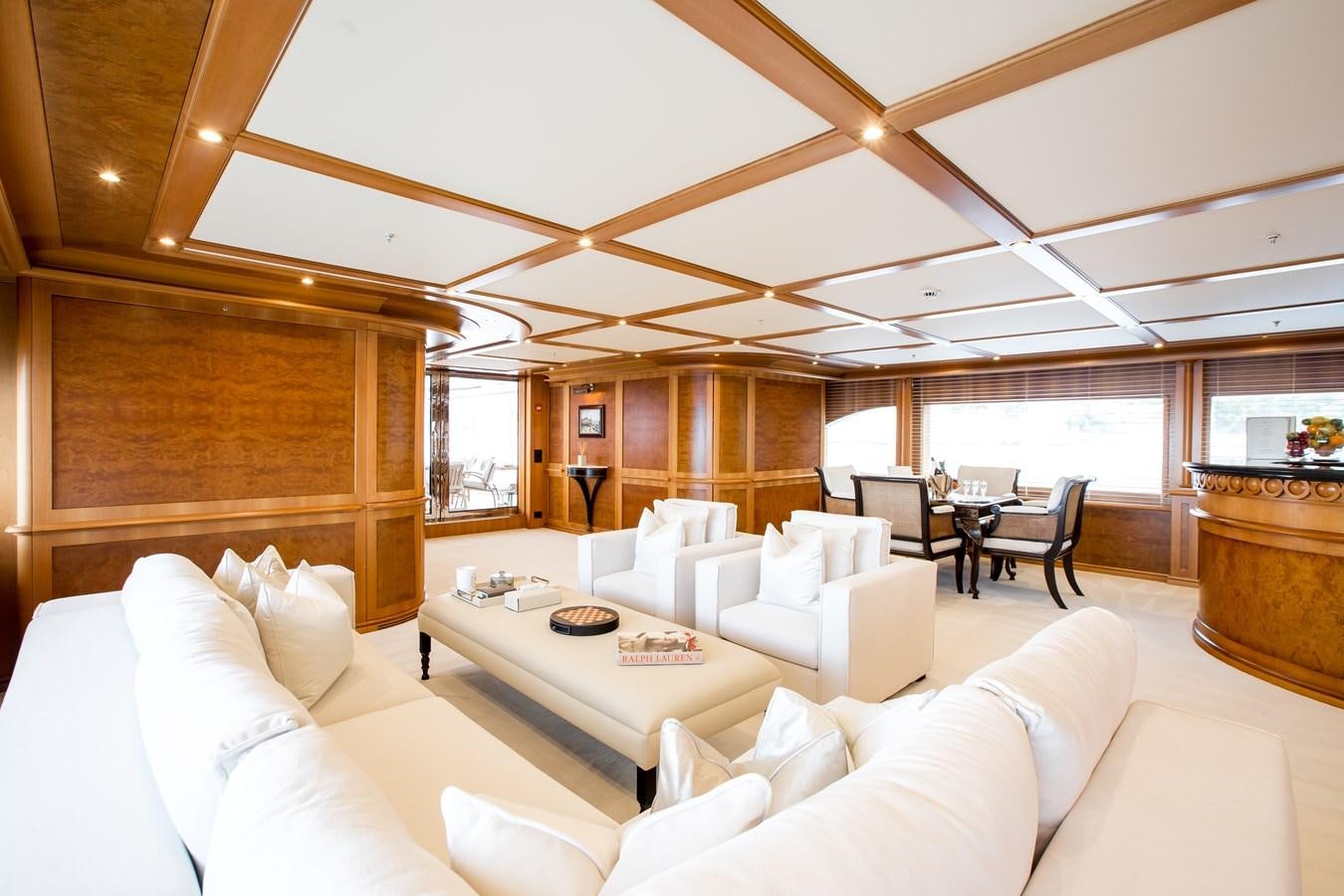 a large living room with a large window aboard ELENI Yacht for Sale