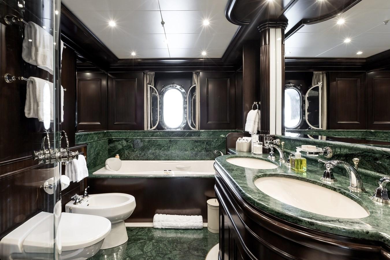 a bathroom with a large mirror aboard ELENI Yacht for Sale