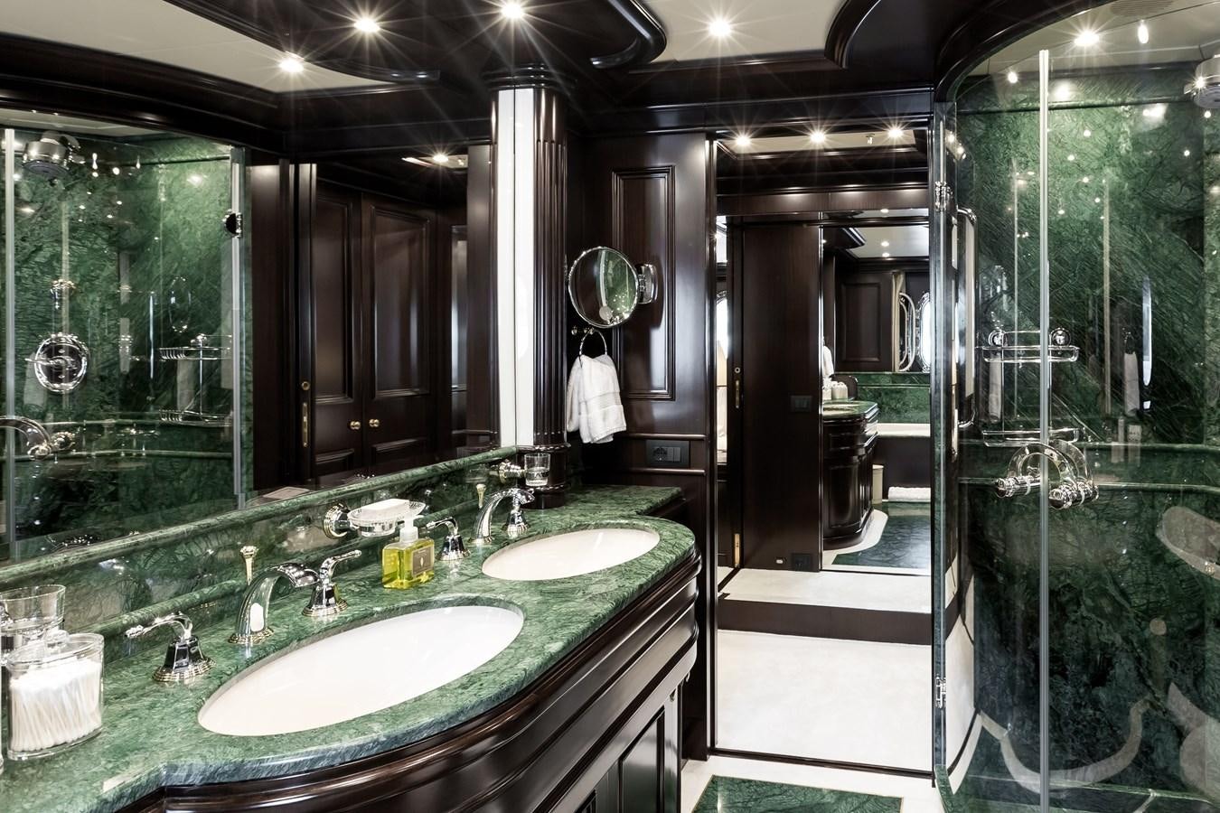 a bathroom with a large mirror aboard ELENI Yacht for Sale