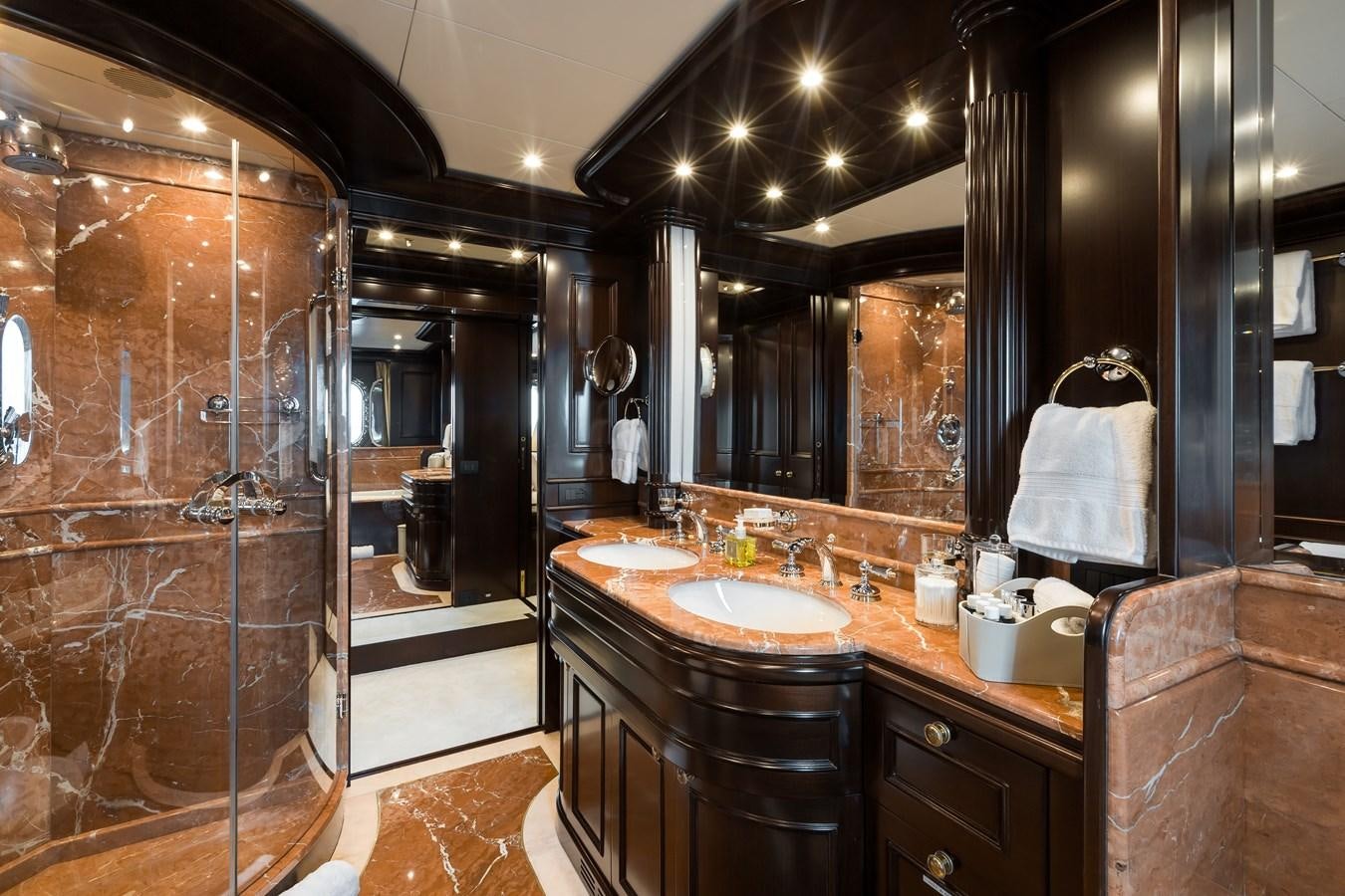 a bathroom with a large mirror aboard ELENI Yacht for Sale