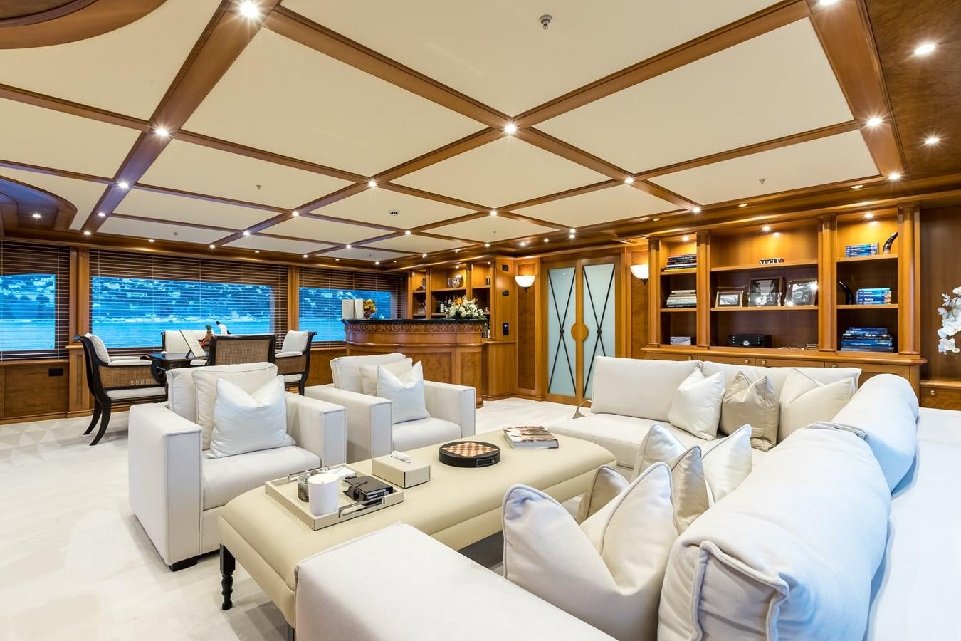 a living room with a large window aboard ELENI Yacht for Sale