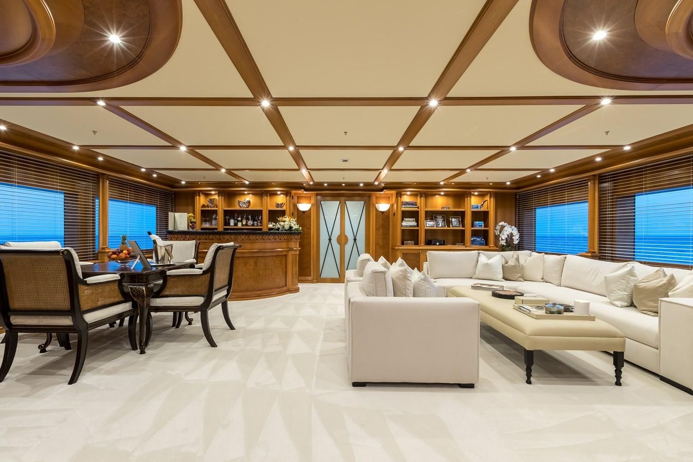 a living room with a couch and a table aboard ELENI Yacht for Sale