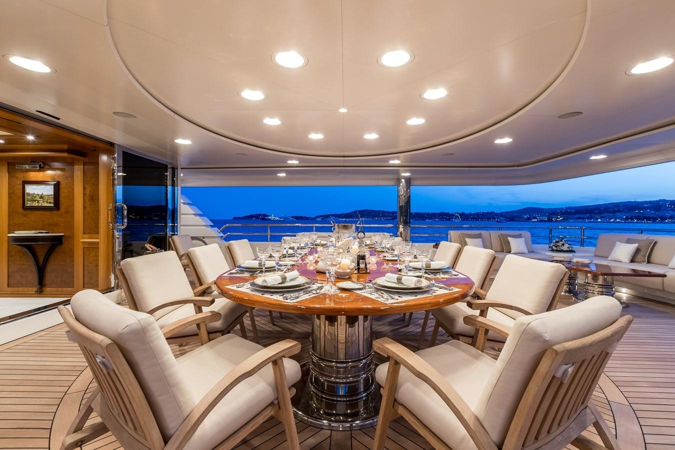 a large dining room with a large table and chairs aboard ELENI Yacht for Sale