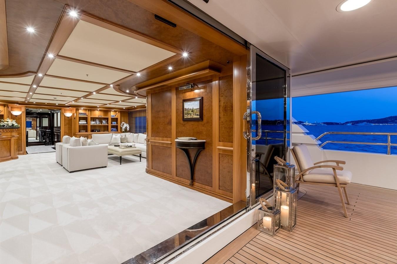 a large room with a pool table and chairs aboard ELENI Yacht for Sale