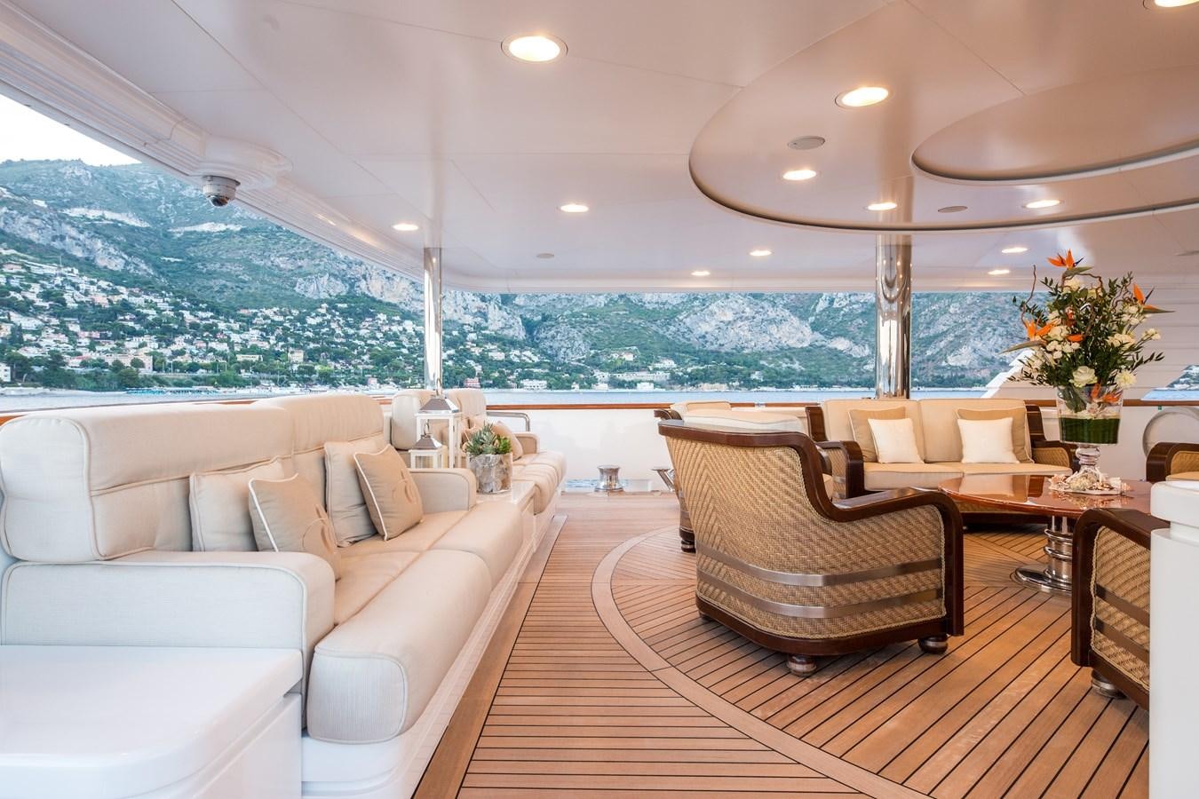 a living room with a large window aboard ELENI Yacht for Sale