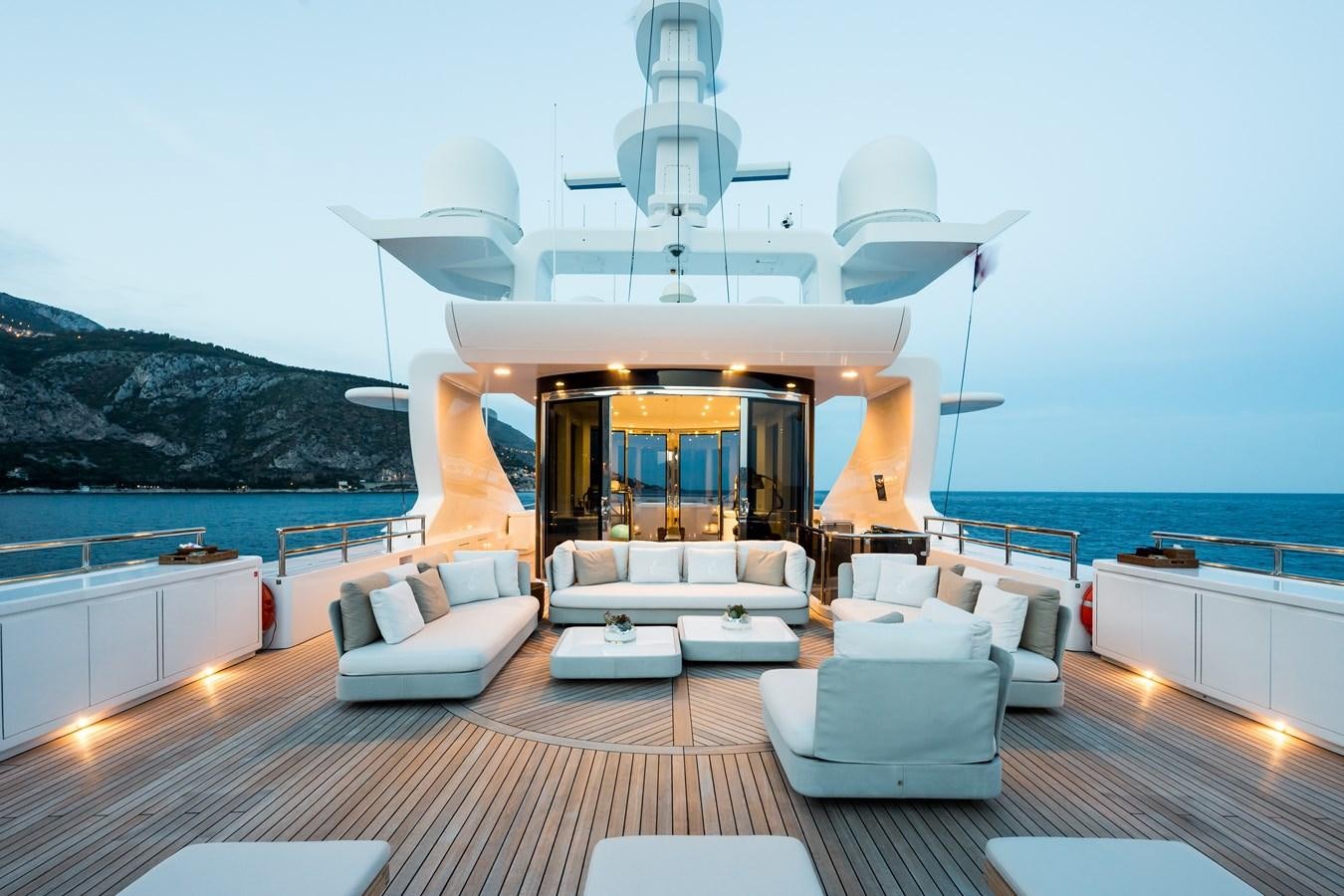 a large living room with a large open window aboard ELENI Yacht for Sale