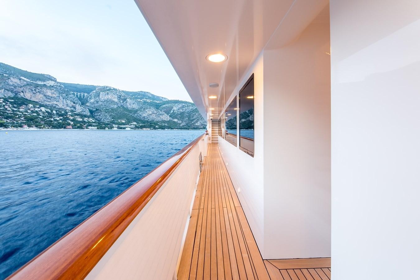 a long wooden walkway on a body of water aboard ELENI Yacht for Sale