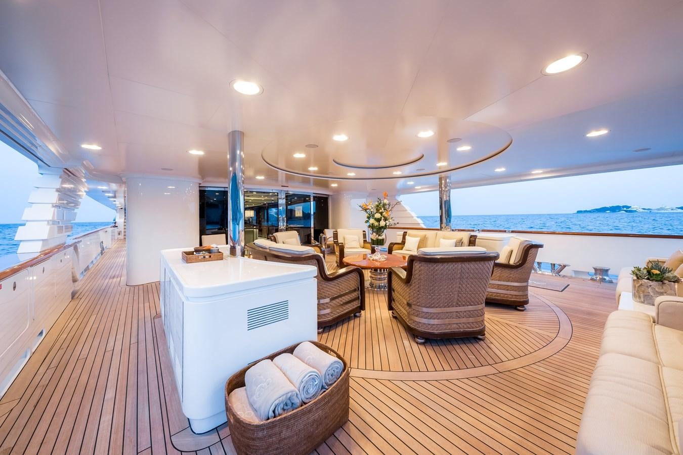 a room with a table chairs and a large window aboard ELENI Yacht for Sale
