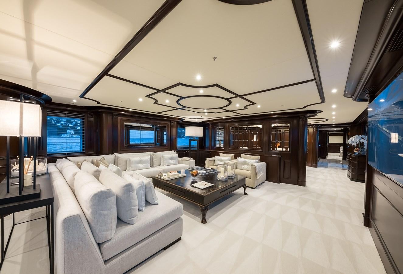 a living room with a large screen aboard ELENI Yacht for Sale