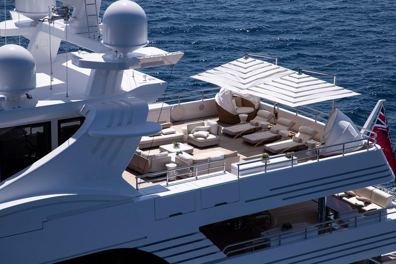 a boat with a deck and chairs on it aboard ELENI Yacht for Sale