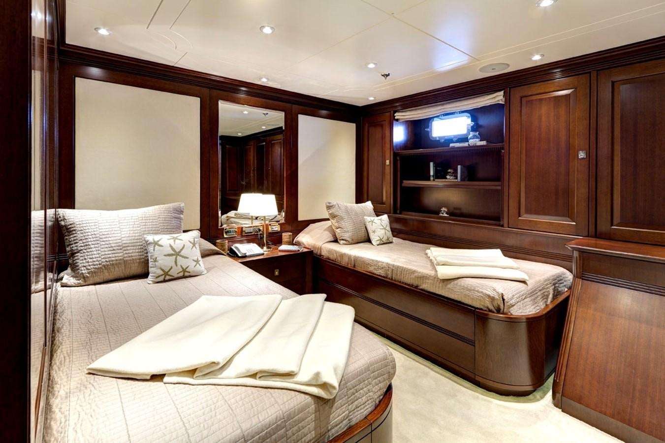 a room with a bed and a tv aboard AZTECA Yacht for Sale
