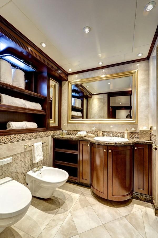 a bathroom with a large mirror aboard AZTECA Yacht for Sale