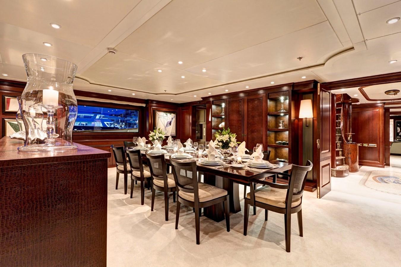 a large dining room with a large table and chairs aboard AZTECA Yacht for Sale