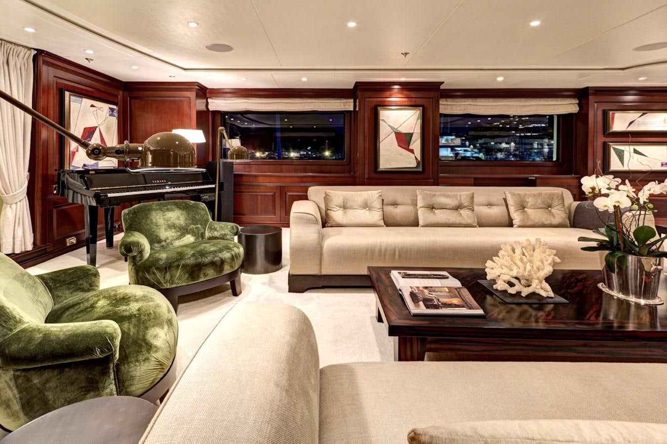 a living room with a couch and a coffee table aboard AZTECA Yacht for Sale