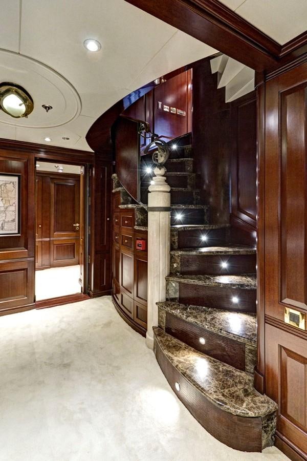 a large wooden staircase aboard AZTECA Yacht for Sale