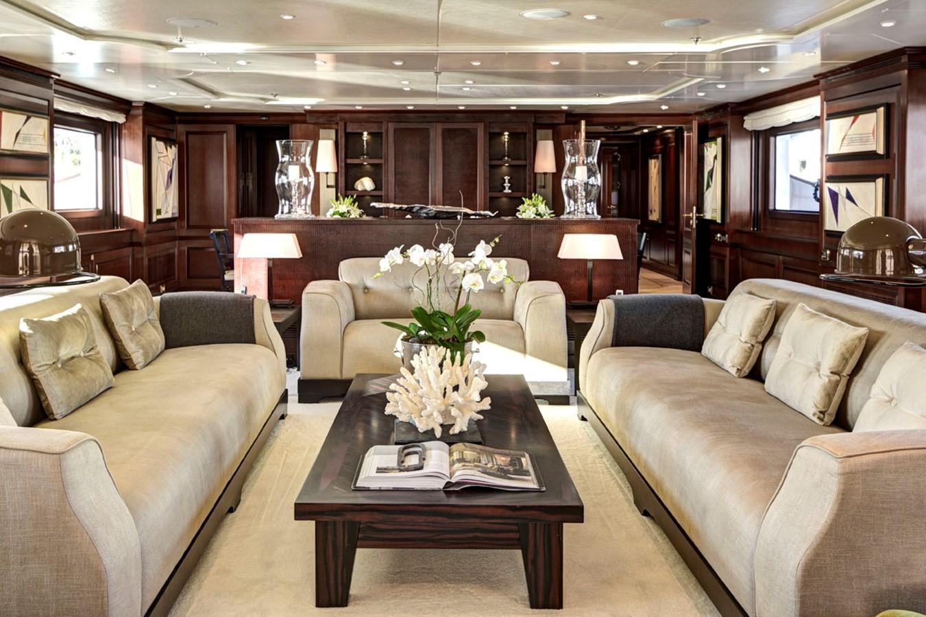 a living room with a couch and a coffee table aboard AZTECA Yacht for Sale