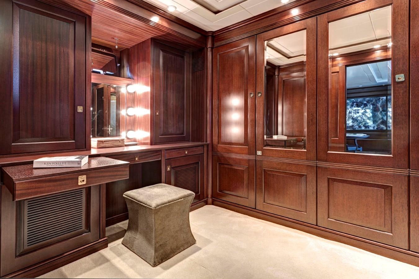 a room with wooden cabinets aboard AZTECA Yacht for Sale