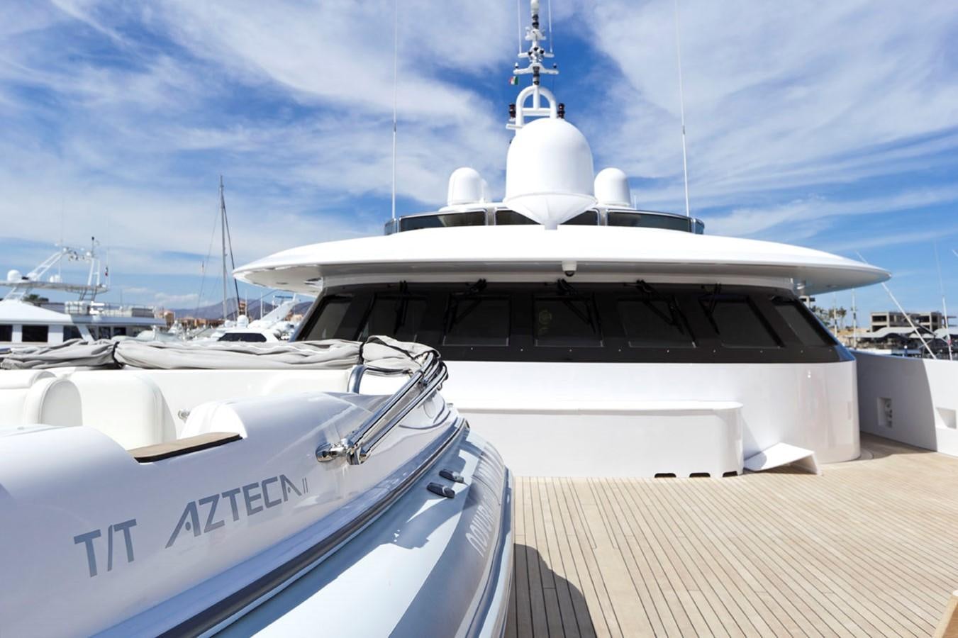 a boat docked at a pier aboard AZTECA Yacht for Charter
