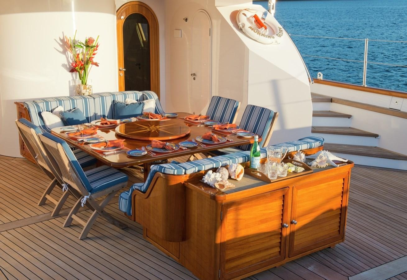 a dining table on a boat aboard MORNING GLORY Yacht for Sale