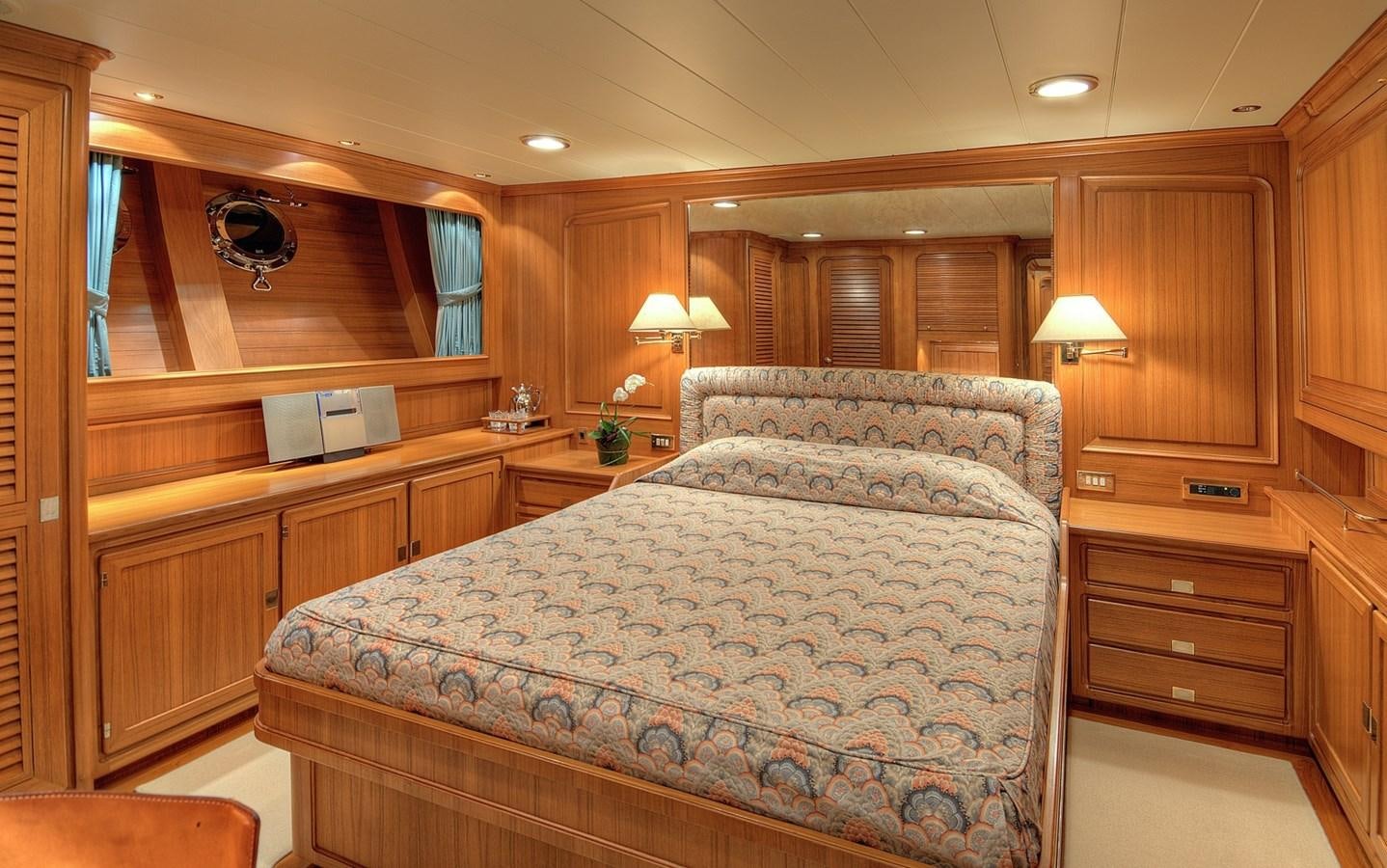 a bedroom with a large bed aboard MORNING GLORY Yacht for Sale
