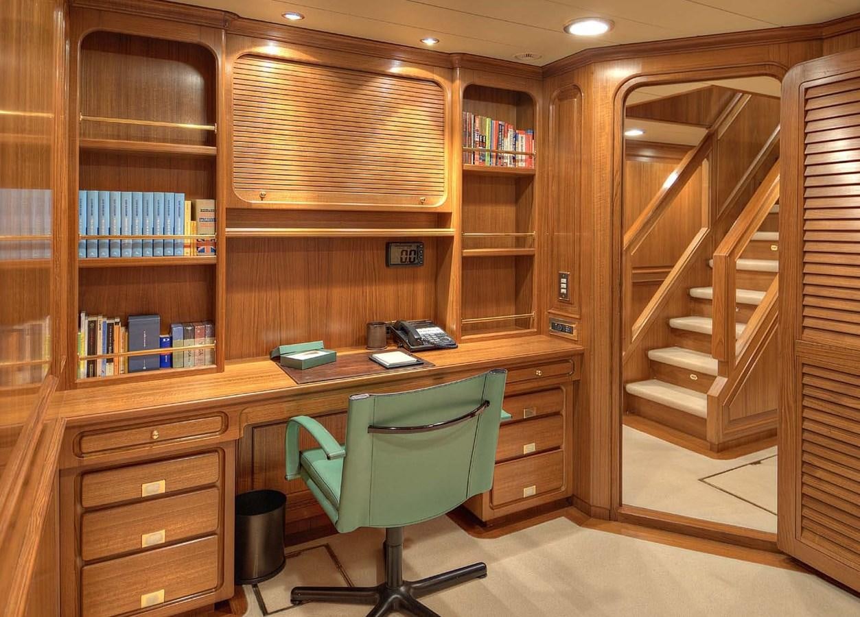 a room with a desk and a chair aboard MORNING GLORY Yacht for Sale