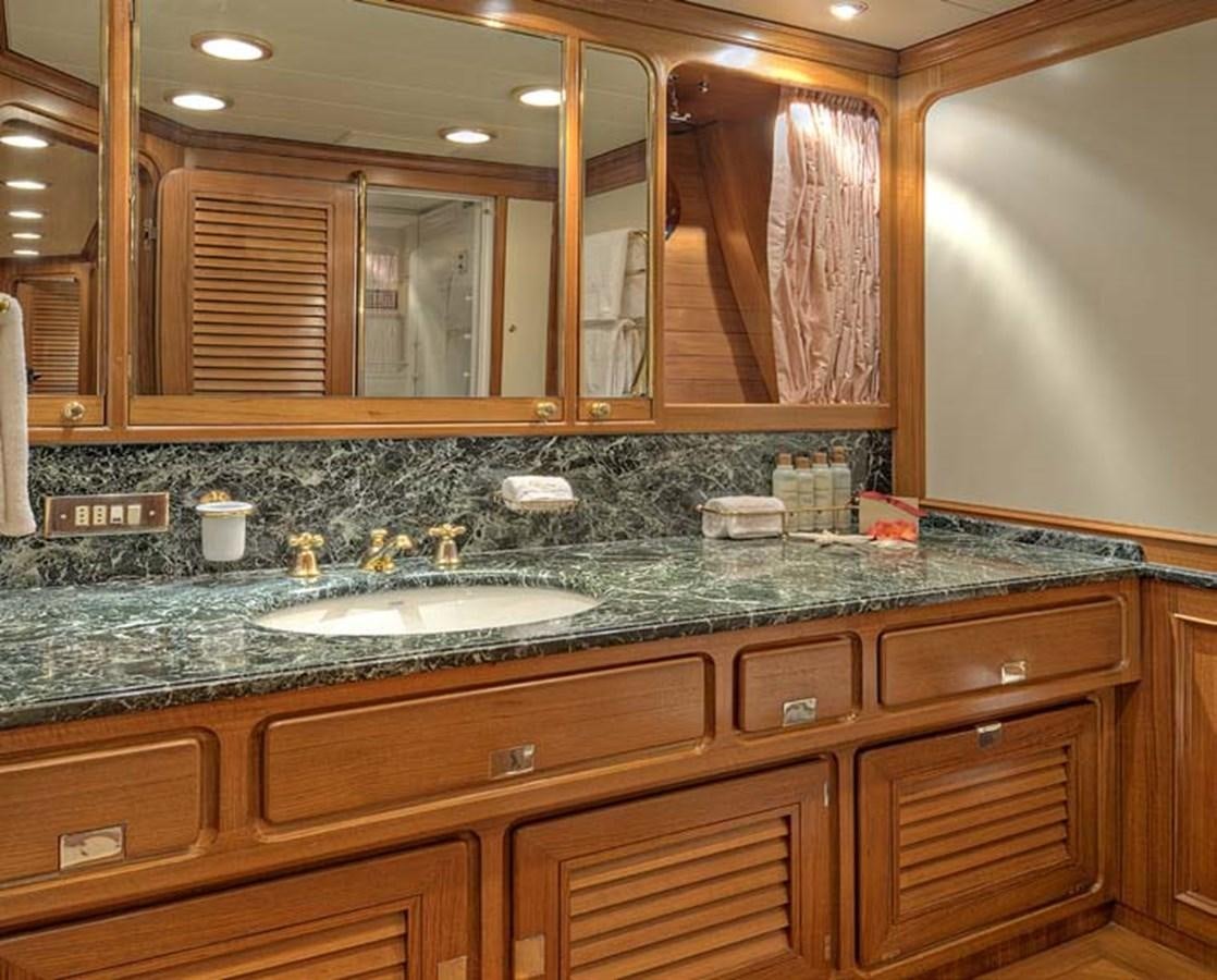 a bathroom with a large mirror aboard MORNING GLORY Yacht for Sale