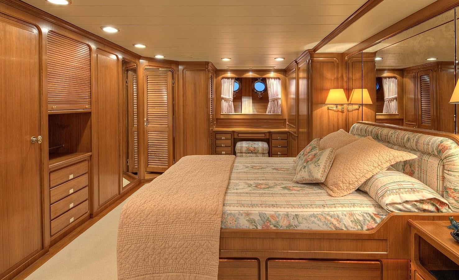 a large bed in a hotel room aboard MORNING GLORY Yacht for Sale