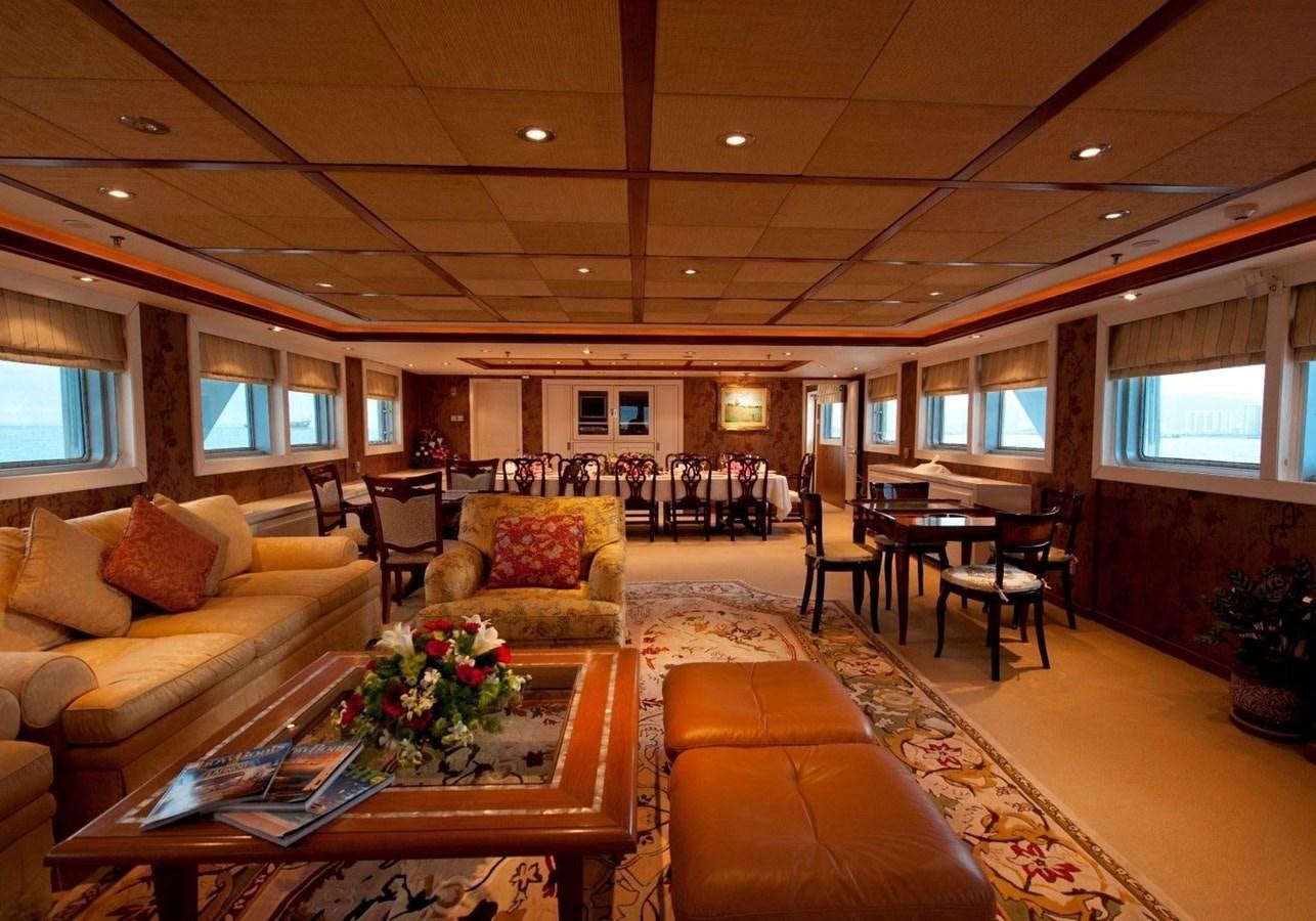a living room with a couch and a coffee table aboard LANGKAWI LADY Yacht for Sale