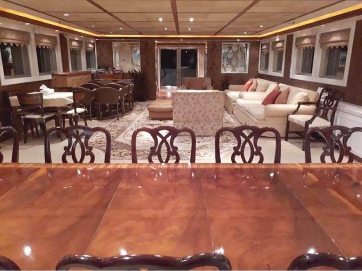 a restaurant with tables and chairs aboard LANGKAWI LADY Yacht for Sale