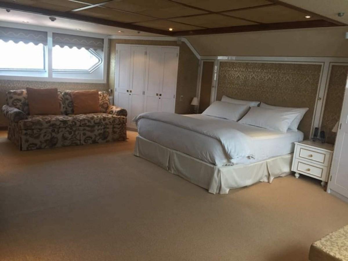 a large bedroom with a bed aboard LANGKAWI LADY Yacht for Sale