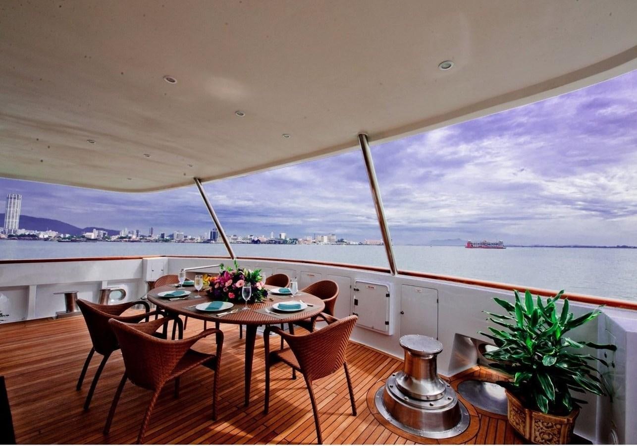 a room with a table and chairs aboard LANGKAWI LADY Yacht for Sale