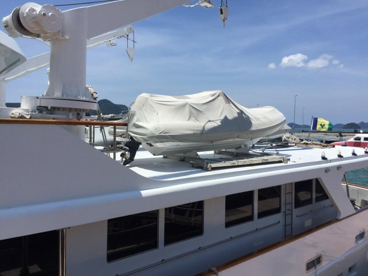 a white boat on a dock aboard LANGKAWI LADY Yacht for Sale