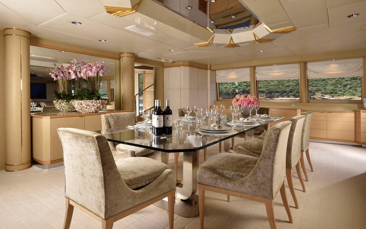 a large kitchen with a table and chairs aboard AZZURRA II Yacht for Sale