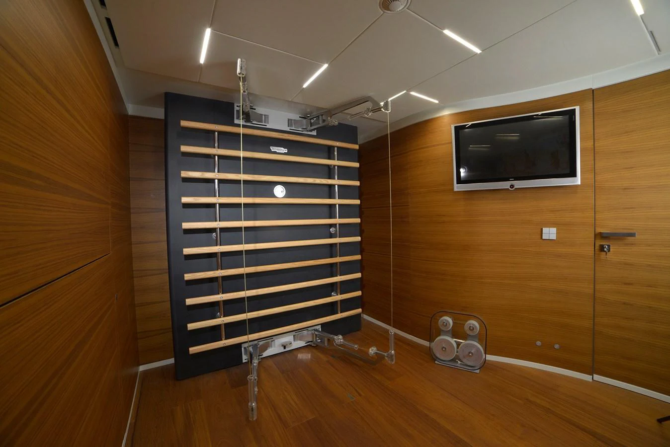 a tv on a stand in a room aboard NATIVA Yacht for Sale
