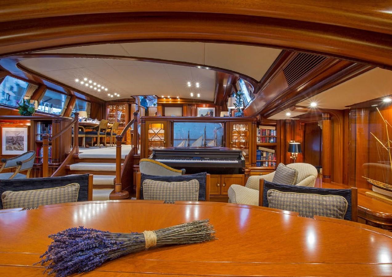 a room with a table and chairs aboard HYPERION Yacht for Sale