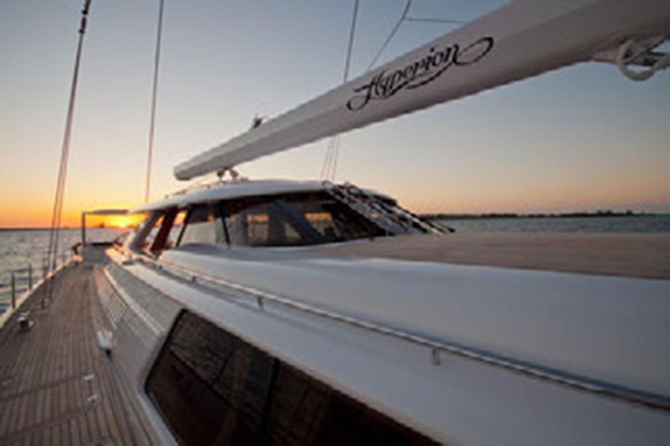 a white boat on a dock aboard HYPERION Yacht for Sale