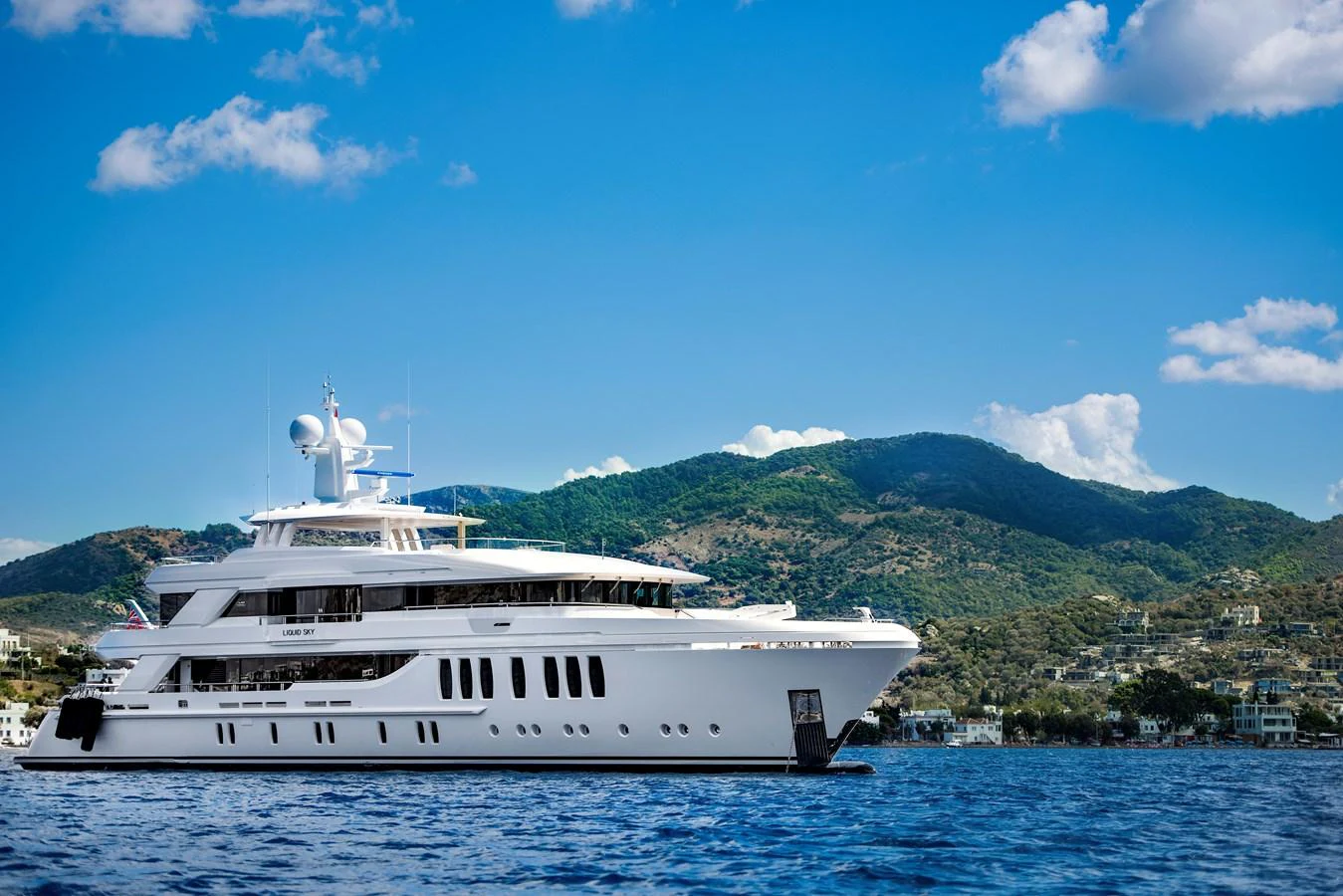 a white boat on water aboard CMB 47 SERIES Yacht for Sale