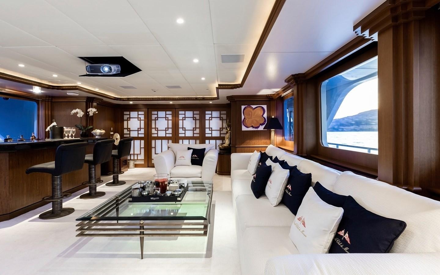a room with a couch and a table aboard SIERRA 2 Yacht for Sale