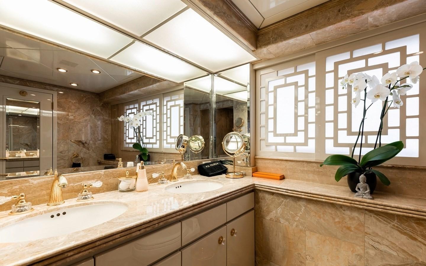 a bathroom with a large mirror aboard SIERRA 2 Yacht for Sale