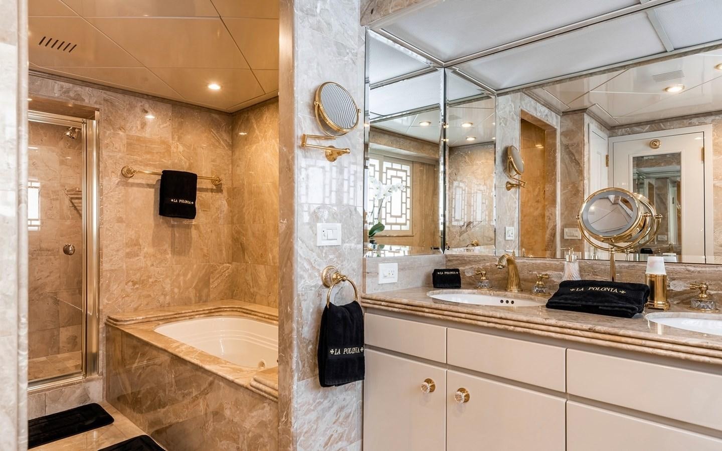 a bathroom with a large mirror aboard SIERRA 2 Yacht for Sale
