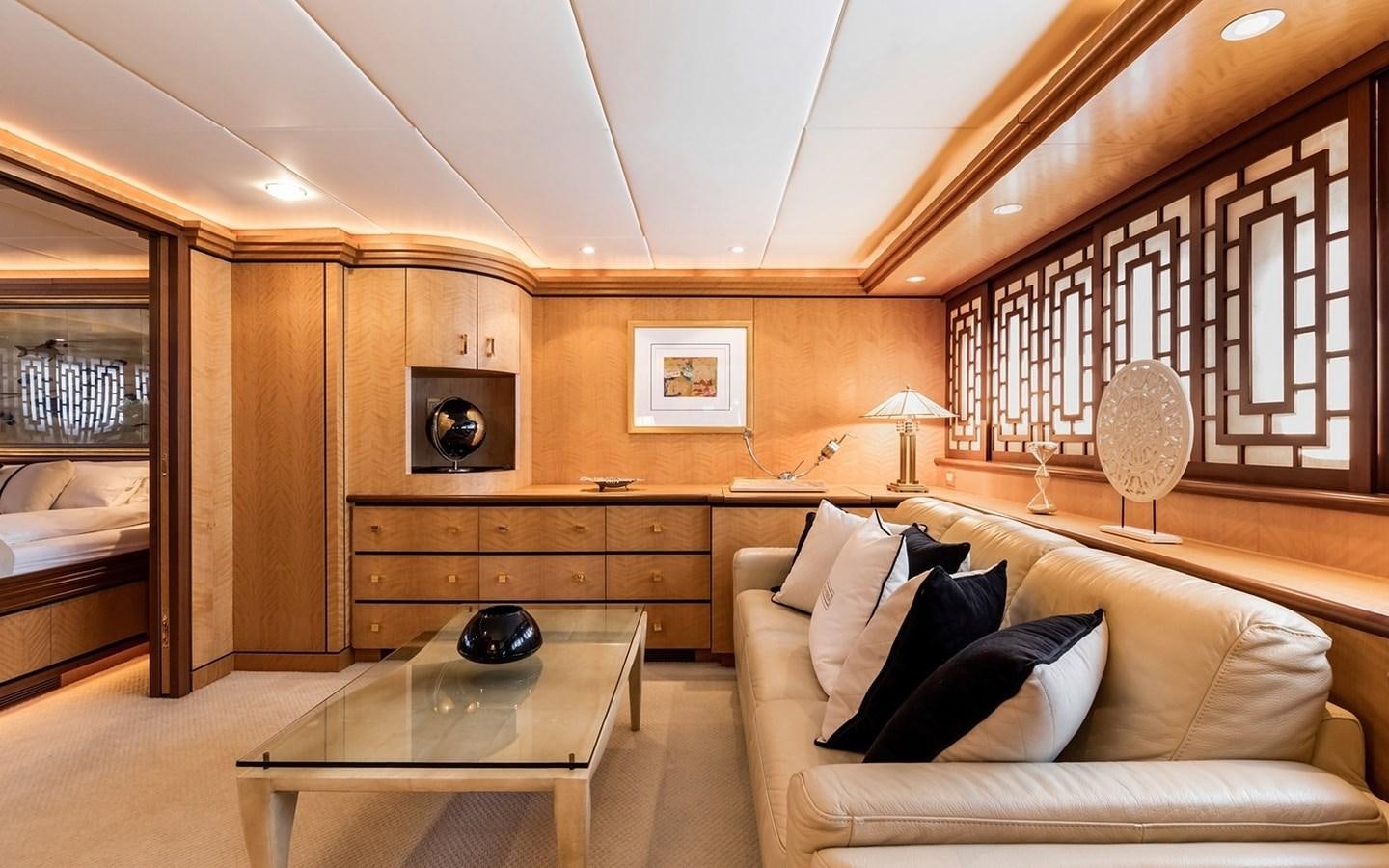 a living room with a couch and a television aboard SIERRA 2 Yacht for Sale