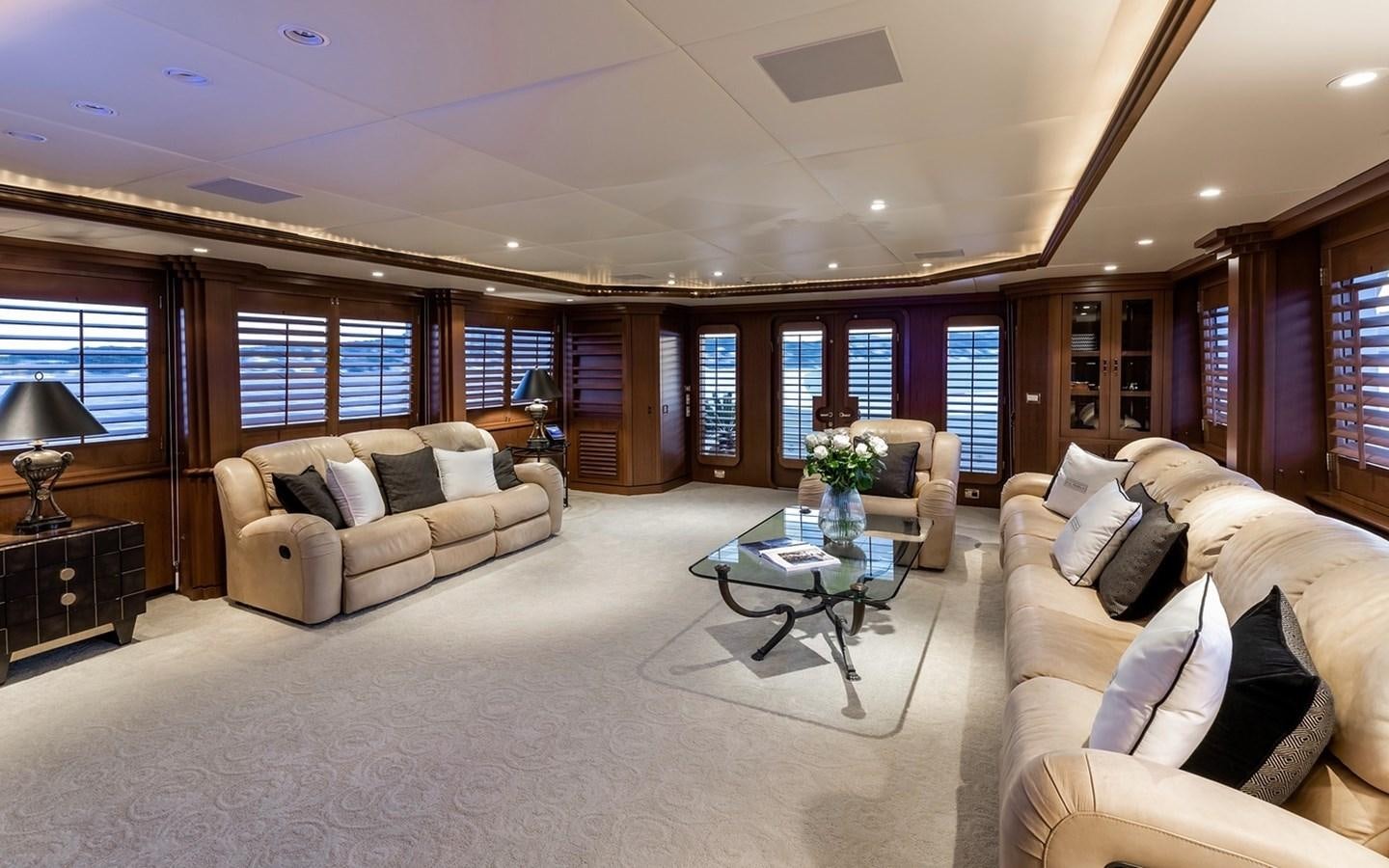 a living room with a couch and a coffee table aboard SIERRA 2 Yacht for Sale