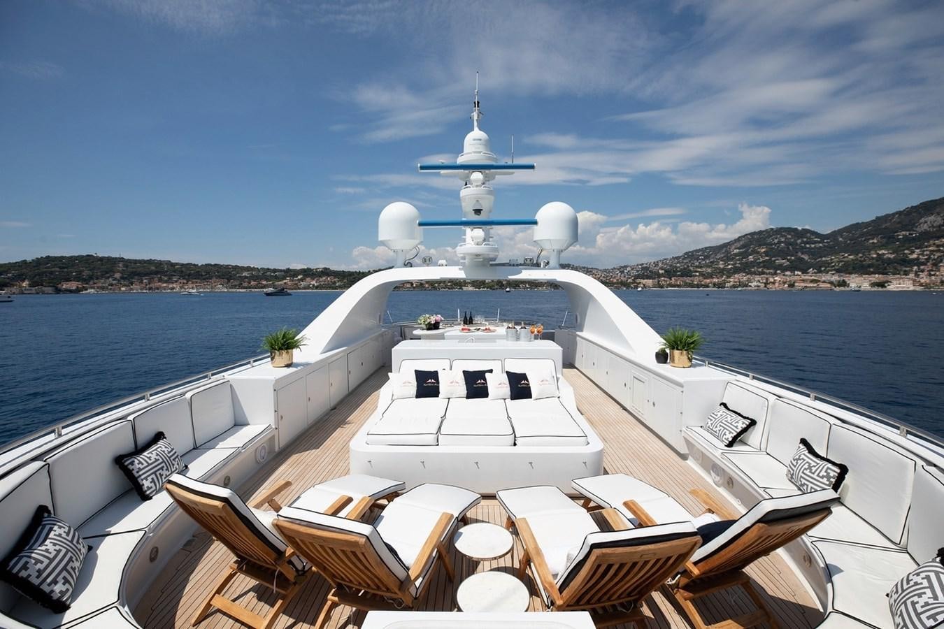 a boat on a large body of water with a large white boat in it aboard SIERRA 2 Yacht for Sale